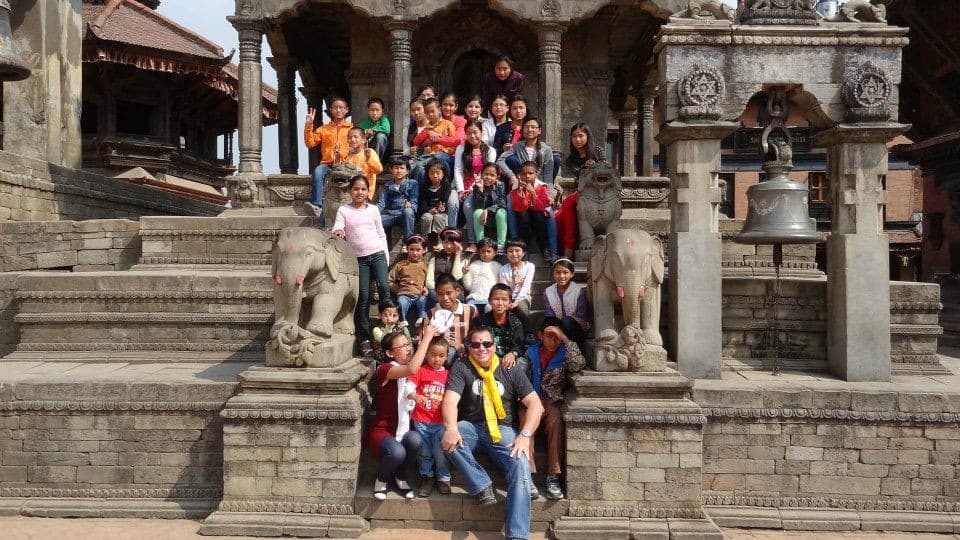 The Rainbow House children on the steps of a temple in Bhaktapur, 2013