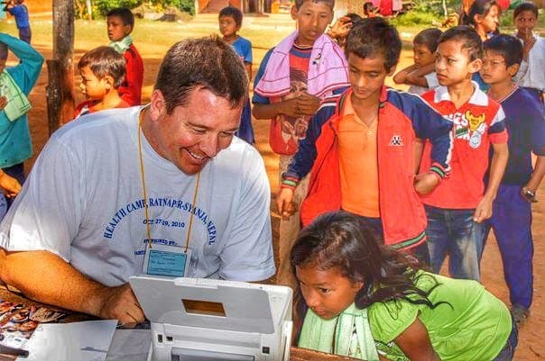 Aaron printing a photo for the kids. For most of them it was the first picture of themselves they had ever seen.